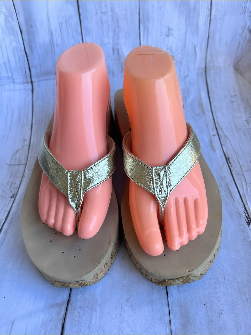 Volatile Gold thong wedge sandals with a cork platform,